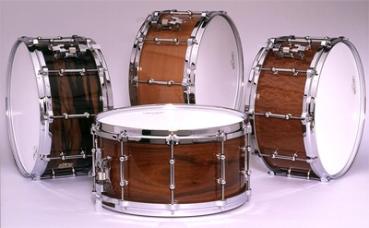 left to right: Macassar Ebony, Pearwood, Sapale Pomele  and (center) Santos Rosewood Ludwig snare drum finishes